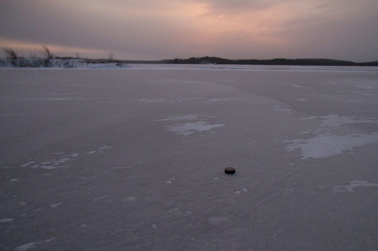 hockey puck on frozen lake