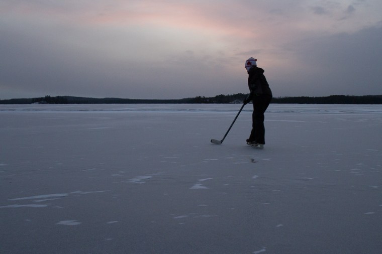 solo skater with stick and puck