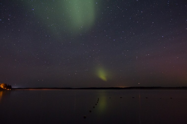 patches of green in starry sky